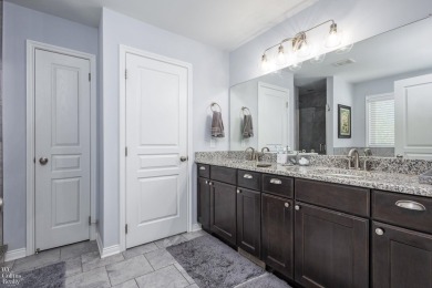 Welcome to this beautifully maintained 4-bedroom, 2.5-bathroom on Boulder Pointe Golf Club and Conference Center in Michigan - for sale on GolfHomes.com, golf home, golf lot