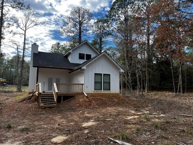 Discover tranquility in this secluded haven situated in the on Rayburn Country Club in Texas - for sale on GolfHomes.com, golf home, golf lot