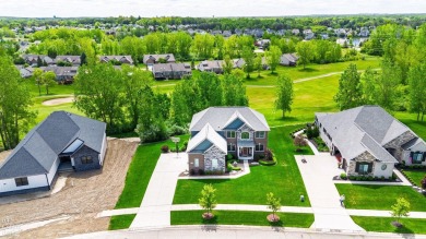Welcome to this beautifully maintained 4-bedroom, 2.5-bathroom on Boulder Pointe Golf Club and Conference Center in Michigan - for sale on GolfHomes.com, golf home, golf lot
