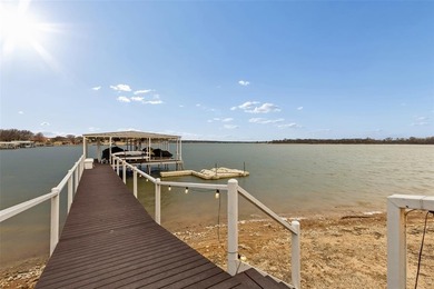Poised on the open waters of Gated Resort on Eagle Mountain Lake on The Golf Club at Resort Eagle Mountain Lake in Texas - for sale on GolfHomes.com, golf home, golf lot