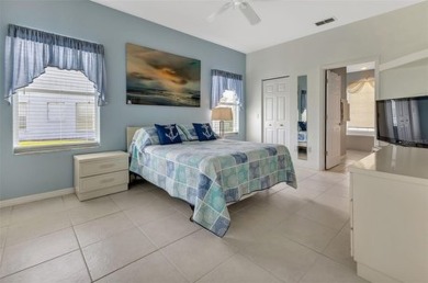SENSATIONAL WATER VIEW from a MASSIVE enclosed and tiled lanai on Kings Gate Golf Club in Florida - for sale on GolfHomes.com, golf home, golf lot