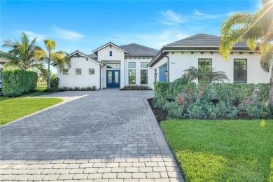 Sophisticated, serene, contemporary, and warm, this absolutely on The Golf Club At Fiddlers Creek in Florida - for sale on GolfHomes.com, golf home, golf lot