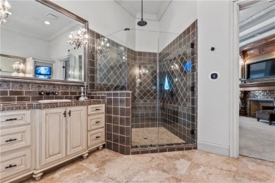 This custom estate sits on a rare 1.4-acre wooded lot backing to on The Traditions Club At Texas A and M in Texas - for sale on GolfHomes.com, golf home, golf lot