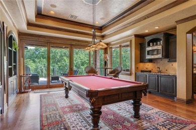 This custom estate sits on a rare 1.4-acre wooded lot backing to on The Traditions Club At Texas A and M in Texas - for sale on GolfHomes.com, golf home, golf lot