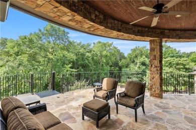 This custom estate sits on a rare 1.4-acre wooded lot backing to on The Traditions Club At Texas A and M in Texas - for sale on GolfHomes.com, golf home, golf lot