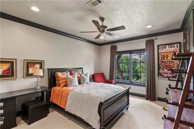 This custom estate sits on a rare 1.4-acre wooded lot backing to on The Traditions Club At Texas A and M in Texas - for sale on GolfHomes.com, golf home, golf lot