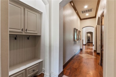 This custom estate sits on a rare 1.4-acre wooded lot backing to on The Traditions Club At Texas A and M in Texas - for sale on GolfHomes.com, golf home, golf lot