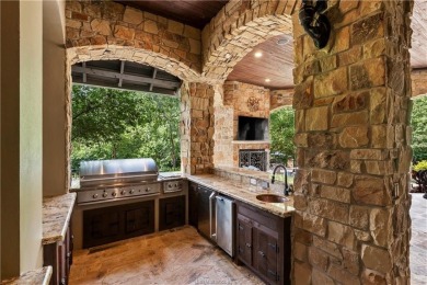 This custom estate sits on a rare 1.4-acre wooded lot backing to on The Traditions Club At Texas A and M in Texas - for sale on GolfHomes.com, golf home, golf lot