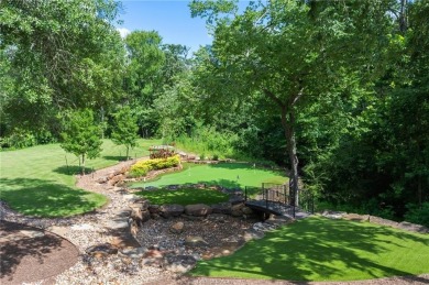 This custom estate sits on a rare 1.4-acre wooded lot backing to on The Traditions Club At Texas A and M in Texas - for sale on GolfHomes.com, golf home, golf lot