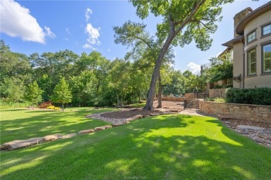 This custom estate sits on a rare 1.4-acre wooded lot backing to on The Traditions Club At Texas A and M in Texas - for sale on GolfHomes.com, golf home, golf lot
