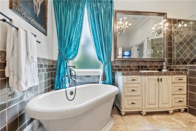 This custom estate sits on a rare 1.4-acre wooded lot backing to on The Traditions Club At Texas A and M in Texas - for sale on GolfHomes.com, golf home, golf lot
