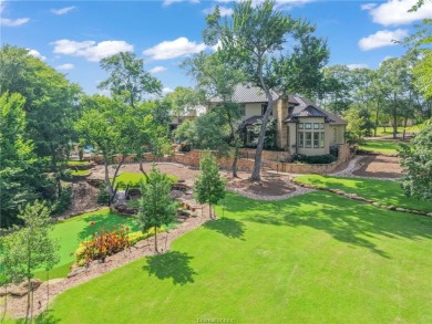 This custom estate sits on a rare 1.4-acre wooded lot backing to on The Traditions Club At Texas A and M in Texas - for sale on GolfHomes.com, golf home, golf lot