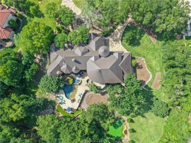 This custom estate sits on a rare 1.4-acre wooded lot backing to on The Traditions Club At Texas A and M in Texas - for sale on GolfHomes.com, golf home, golf lot