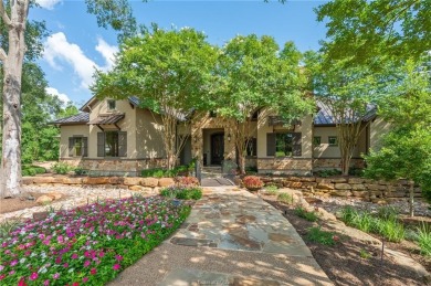 This custom estate sits on a rare 1.4-acre wooded lot backing to on The Traditions Club At Texas A and M in Texas - for sale on GolfHomes.com, golf home, golf lot
