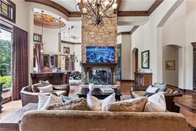 This custom estate sits on a rare 1.4-acre wooded lot backing to on The Traditions Club At Texas A and M in Texas - for sale on GolfHomes.com, golf home, golf lot