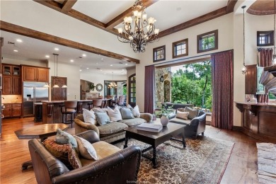 This custom estate sits on a rare 1.4-acre wooded lot backing to on The Traditions Club At Texas A and M in Texas - for sale on GolfHomes.com, golf home, golf lot
