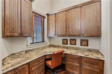 This custom estate sits on a rare 1.4-acre wooded lot backing to on The Traditions Club At Texas A and M in Texas - for sale on GolfHomes.com, golf home, golf lot