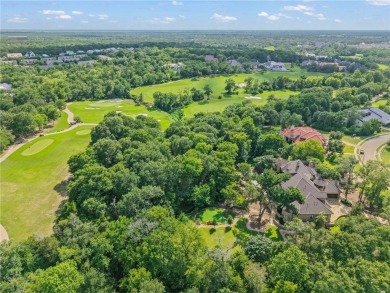 This custom estate sits on a rare 1.4-acre wooded lot backing to on The Traditions Club At Texas A and M in Texas - for sale on GolfHomes.com, golf home, golf lot