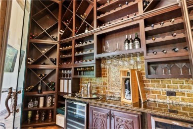This custom estate sits on a rare 1.4-acre wooded lot backing to on The Traditions Club At Texas A and M in Texas - for sale on GolfHomes.com, golf home, golf lot
