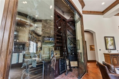 This custom estate sits on a rare 1.4-acre wooded lot backing to on The Traditions Club At Texas A and M in Texas - for sale on GolfHomes.com, golf home, golf lot