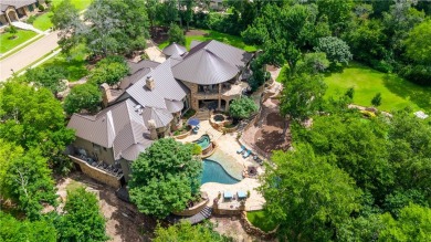 This custom estate sits on a rare 1.4-acre wooded lot backing to on The Traditions Club At Texas A and M in Texas - for sale on GolfHomes.com, golf home, golf lot