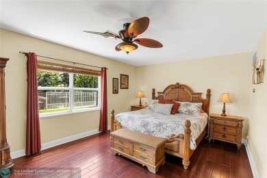 Unique Key West-style waterfront retreat in prestigious Golf on Plantation Preserve Golf Course in Florida - for sale on GolfHomes.com, golf home, golf lot