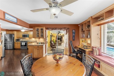 Unique Key West-style waterfront retreat in prestigious Golf on Plantation Preserve Golf Course in Florida - for sale on GolfHomes.com, golf home, golf lot