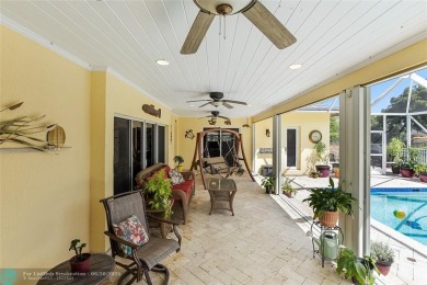 Unique Key West-style waterfront retreat in prestigious Golf on Plantation Preserve Golf Course in Florida - for sale on GolfHomes.com, golf home, golf lot