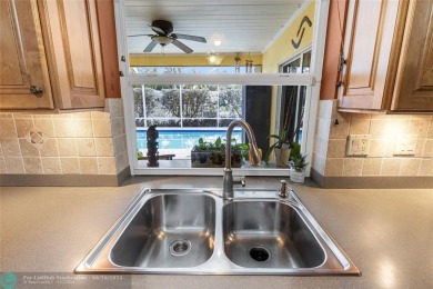 Unique Key West-style waterfront retreat in prestigious Golf on Plantation Preserve Golf Course in Florida - for sale on GolfHomes.com, golf home, golf lot
