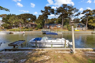 You just can't beat canal front living in Pine Knoll Shores! And on The Country Club of the Crystal Coast in North Carolina - for sale on GolfHomes.com, golf home, golf lot