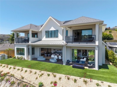 Rising above the prestigious El Niguel Country Club, this on El Niguel Country Club in California - for sale on GolfHomes.com, golf home, golf lot