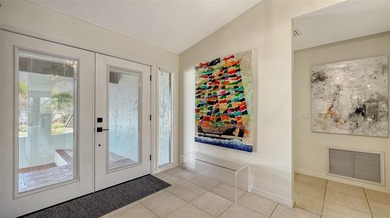 Coastal elegance meets island living in Bay Isles Bayou on on Longboat Key Golf Club Resort in Florida - for sale on GolfHomes.com, golf home, golf lot