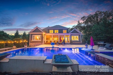 Situated on 1.64 acres w/golf course views, this home offers on Trump National Golf Club Charlotte in North Carolina - for sale on GolfHomes.com, golf home, golf lot
