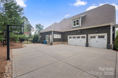 Situated on 1.64 acres w/golf course views, this home offers on Trump National Golf Club Charlotte in North Carolina - for sale on GolfHomes.com, golf home, golf lot
