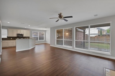 This inviting two-story home offers a practical and comfortable on The Trails of Frisco Golf Club in Texas - for sale on GolfHomes.com, golf home, golf lot