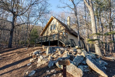 Escape to comfort and nature in this inviting 2BR/2BA bungalow on Woodstone Meadows Golf Course At Massanutten in Virginia - for sale on GolfHomes.com, golf home, golf lot