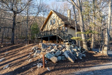 Escape to comfort and nature in this inviting 2BR/2BA bungalow on Woodstone Meadows Golf Course At Massanutten in Virginia - for sale on GolfHomes.com, golf home, golf lot