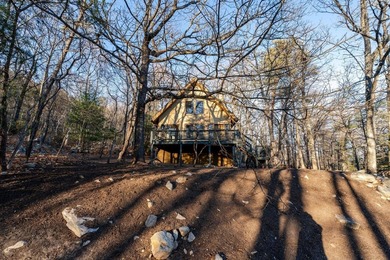 Escape to comfort and nature in this inviting 2BR/2BA bungalow on Woodstone Meadows Golf Course At Massanutten in Virginia - for sale on GolfHomes.com, golf home, golf lot