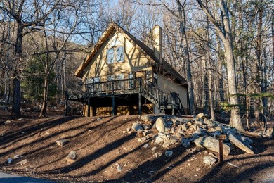 Escape to comfort and nature in this inviting 2BR/2BA bungalow on Woodstone Meadows Golf Course At Massanutten in Virginia - for sale on GolfHomes.com, golf home, golf lot