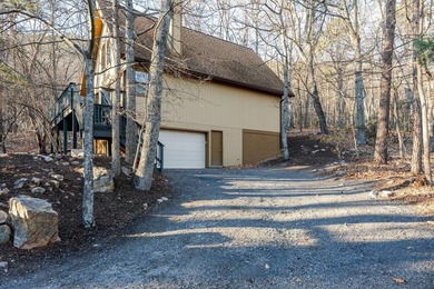 Escape to comfort and nature in this inviting 2BR/2BA bungalow on Woodstone Meadows Golf Course At Massanutten in Virginia - for sale on GolfHomes.com, golf home, golf lot