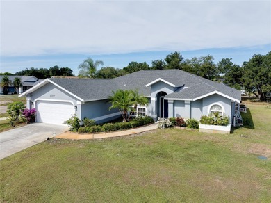 Welcome to this beautifully updated pool home on a spacious on Port Charlotte Golf Club in Florida - for sale on GolfHomes.com, golf home, golf lot