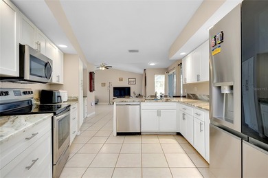 Welcome to this beautifully updated pool home on a spacious on Port Charlotte Golf Club in Florida - for sale on GolfHomes.com, golf home, golf lot