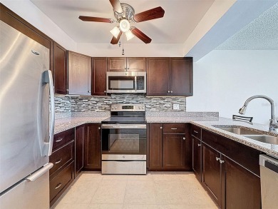 Discover this charming two-bedroom, two-bathroom condo in the on East Bay Golf Club in Florida - for sale on GolfHomes.com, golf home, golf lot