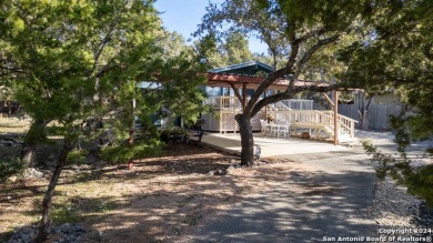 Nestled in a serene setting, this classic rustic home in the on Canyon Lake Golf Club in Texas - for sale on GolfHomes.com, golf home, golf lot