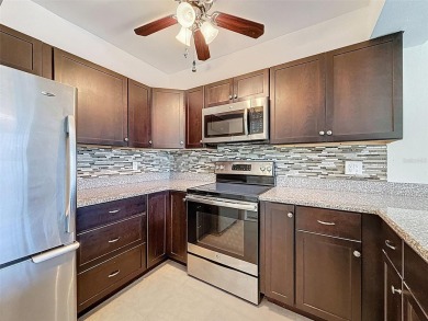 Discover this charming two-bedroom, two-bathroom condo in the on East Bay Golf Club in Florida - for sale on GolfHomes.com, golf home, golf lot