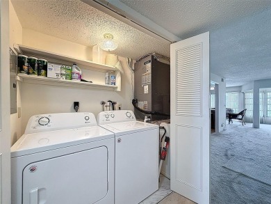 Discover this charming two-bedroom, two-bathroom condo in the on East Bay Golf Club in Florida - for sale on GolfHomes.com, golf home, golf lot