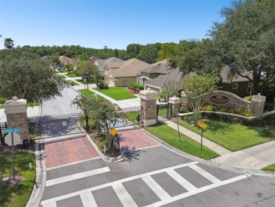 Under contract-accepting backup offers. Exquisite pool home on on Lexington Oaks Golf Club in Florida - for sale on GolfHomes.com, golf home, golf lot