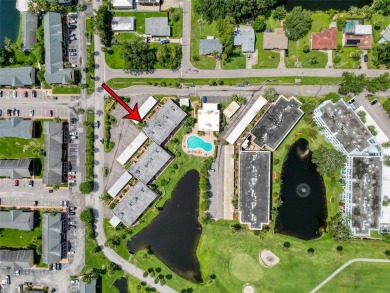 Discover this charming two-bedroom, two-bathroom condo in the on East Bay Golf Club in Florida - for sale on GolfHomes.com, golf home, golf lot