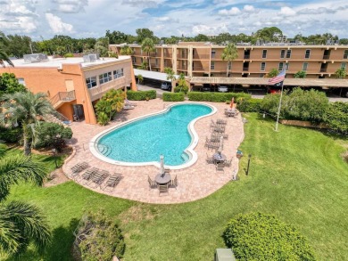 Discover this charming two-bedroom, two-bathroom condo in the on East Bay Golf Club in Florida - for sale on GolfHomes.com, golf home, golf lot