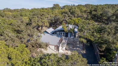 Nestled in a serene setting, this classic rustic home in the on Canyon Lake Golf Club in Texas - for sale on GolfHomes.com, golf home, golf lot